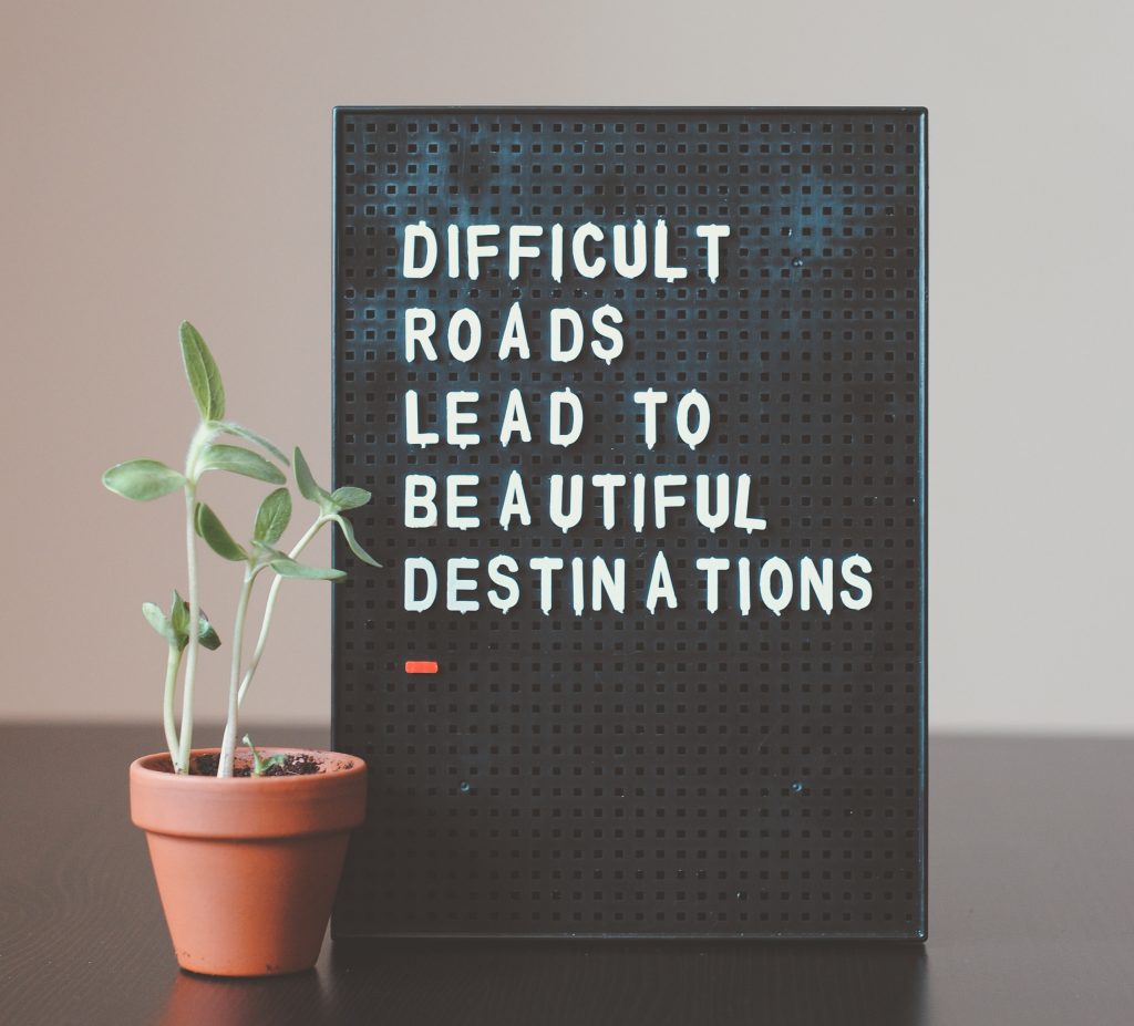 "Difficult roads lead to beautiful destinations" quote image