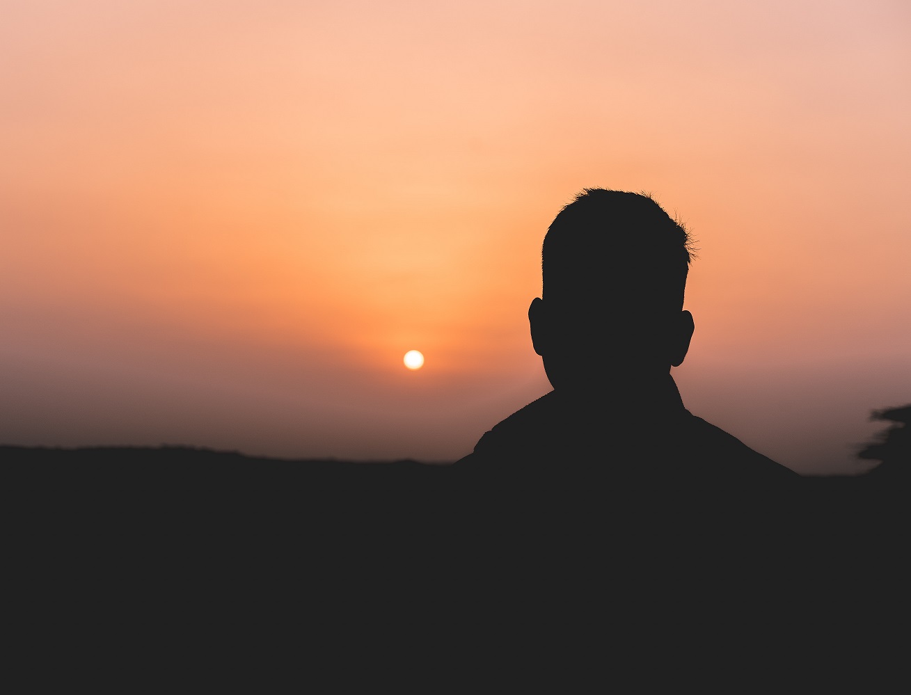 Man silhouette at sunset