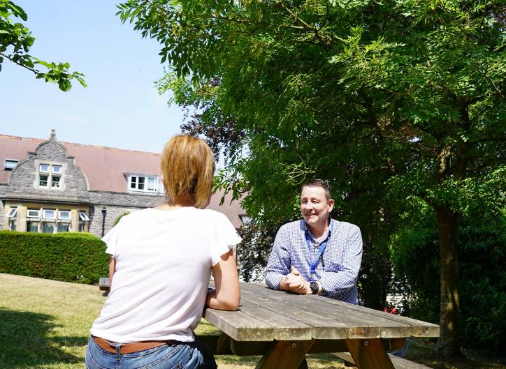 One to one counselling in the garden at Broadway Lodge