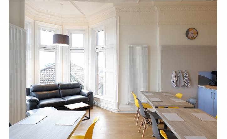 Kitchen and lounge area at Broadway Lodge with large bay window