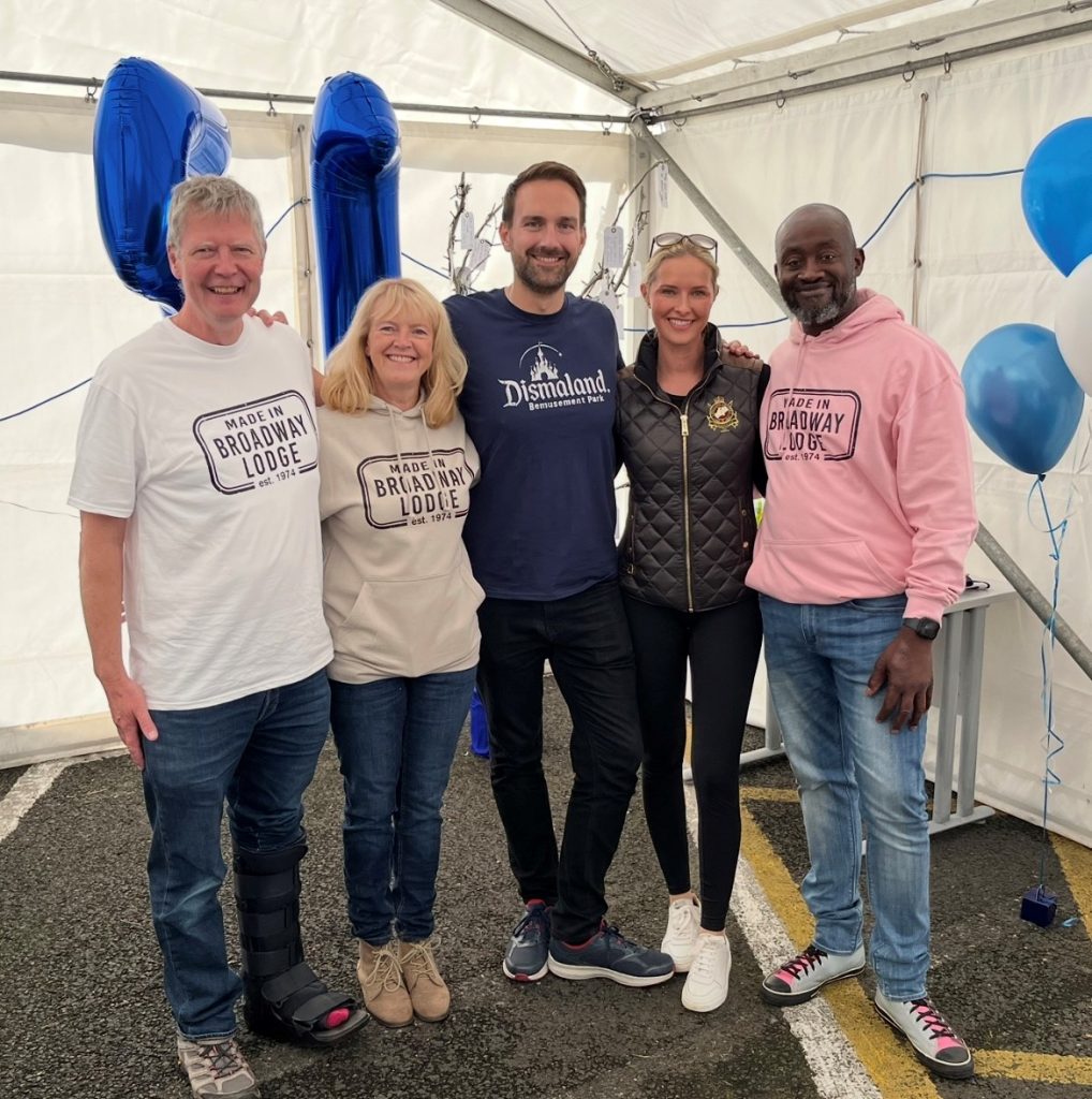 Four staff members in the reunion marquee with Dan Aldridge, our local MP